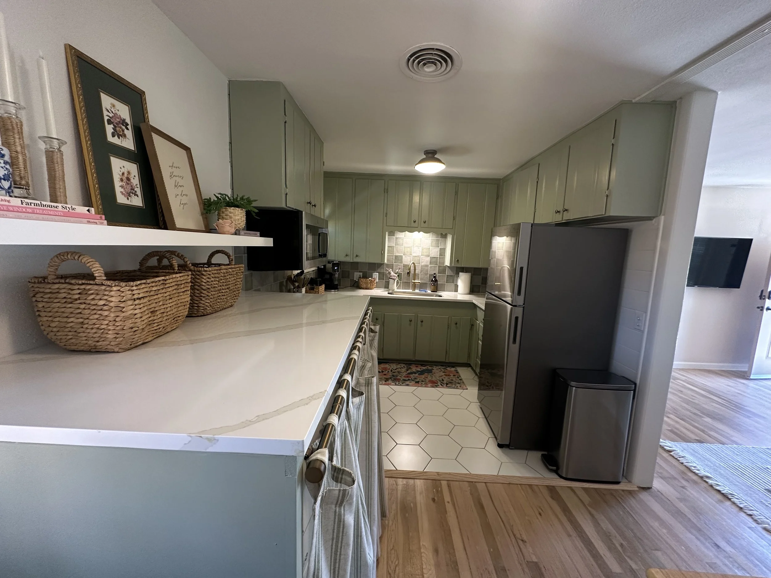 Custom green cabinet kitchen remodel with new countertops