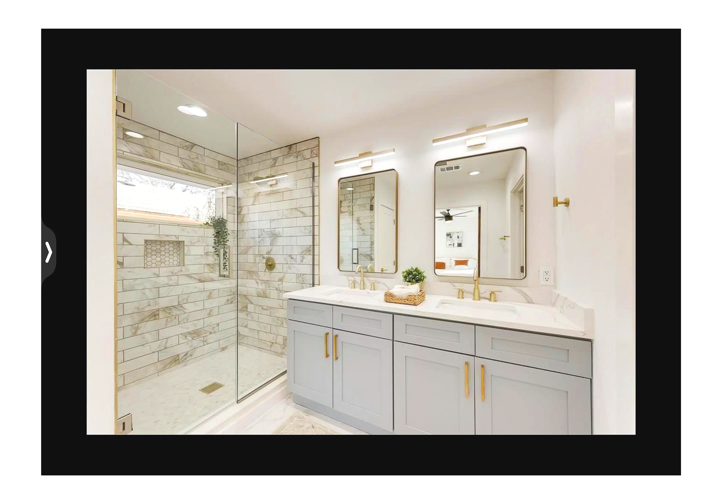 Modern bathroom renovation with glass shower and double vanity